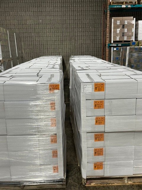 Pallets of cased poly bags staged in the warehouse
