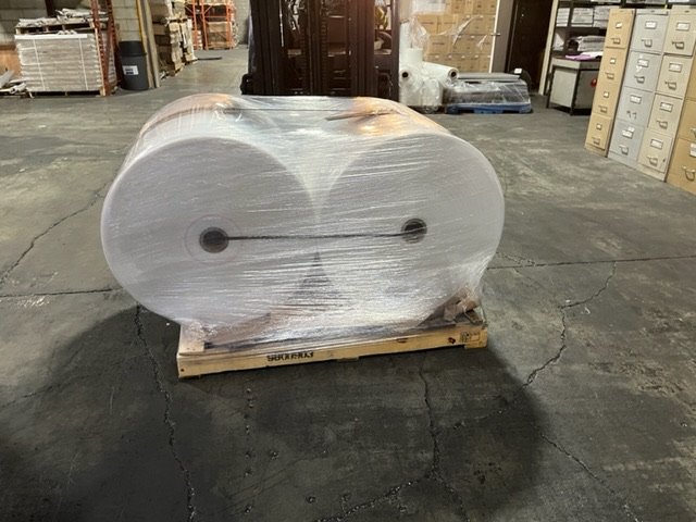 Wide-width clear film roll wrapped on a pallet